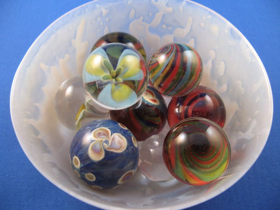 glass marbles in an agate bowl